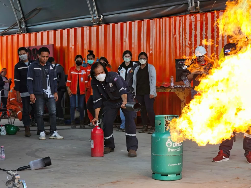 Employees participating in fire drill training at Production Solutions Thailand, enhancing safety preparedness.